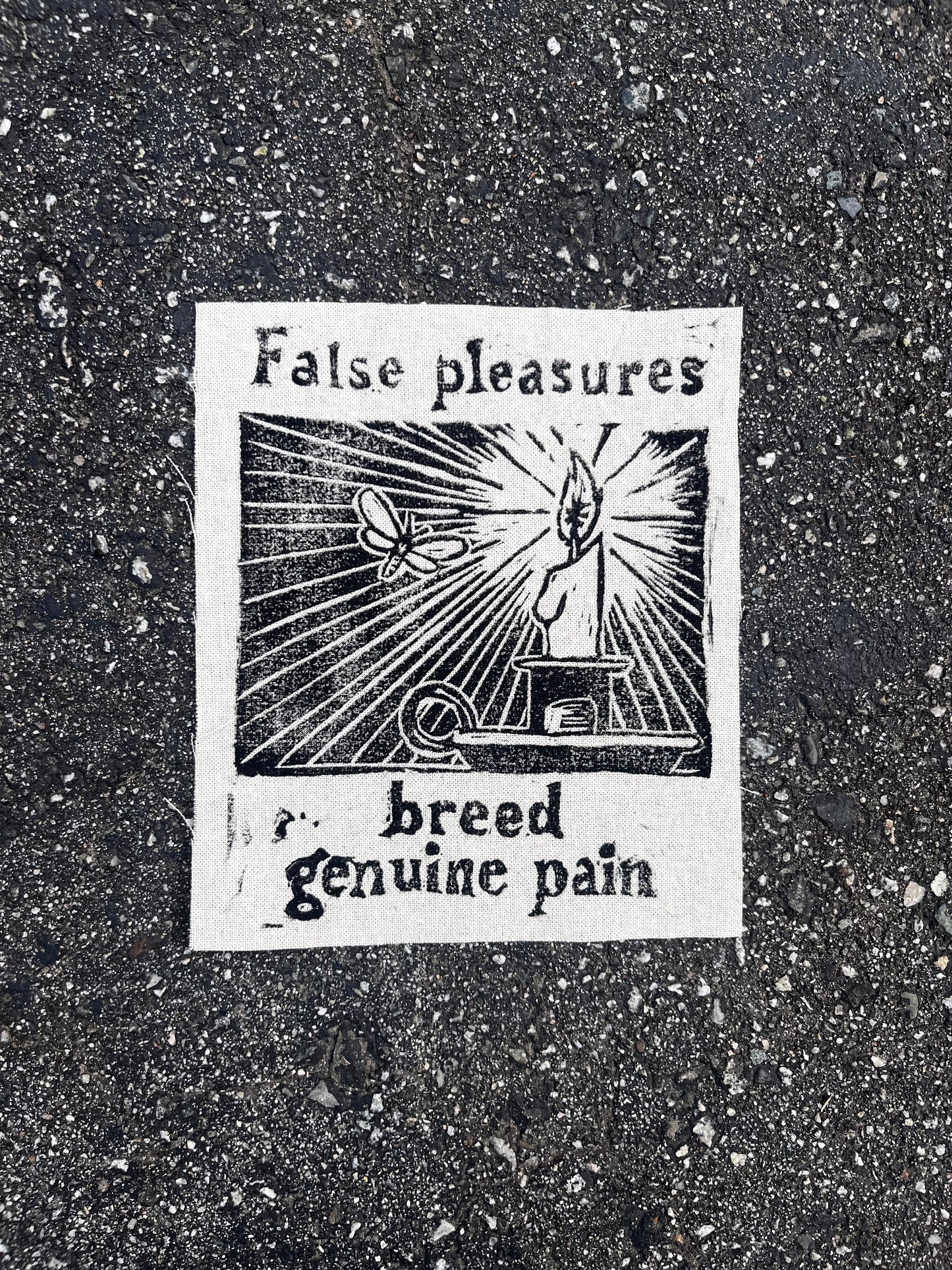 “false pleasures breed genuine pain” block print patch