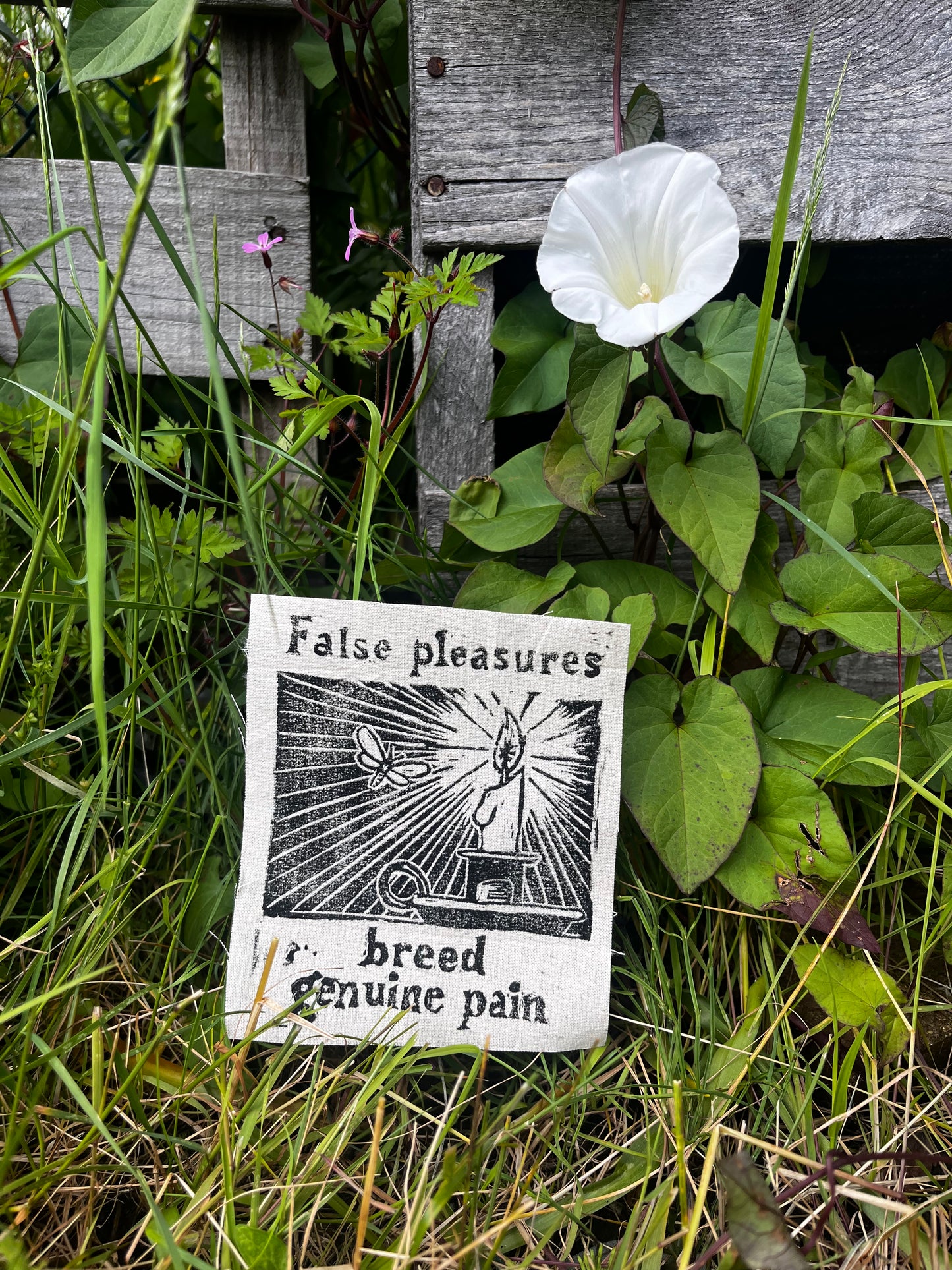 “false pleasures breed genuine pain” block print patch